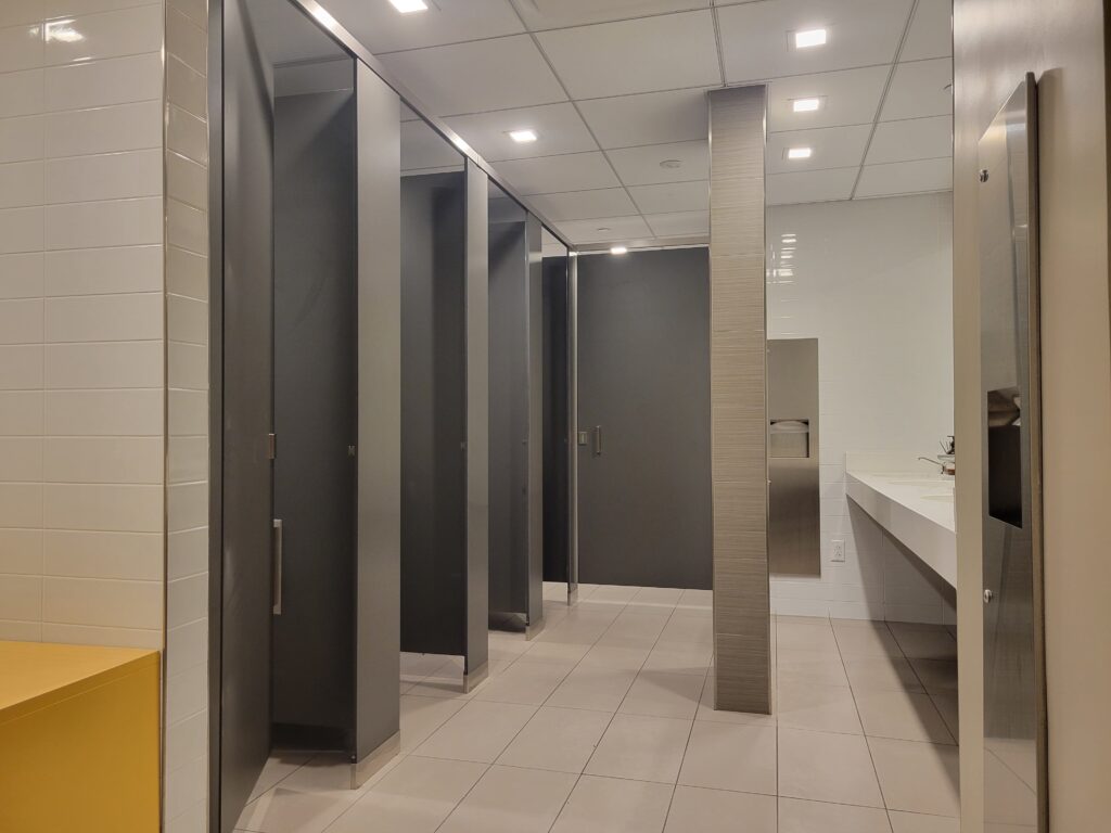 Toilet partition installation at 1375 Broadway